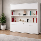 White storage cabinet with shelves and doors in a room with a plant and curtains.